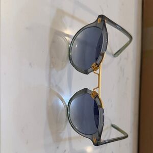 KREWE Round Sunglasses in Translucent Green with Gold Bridge and Blue Lenses